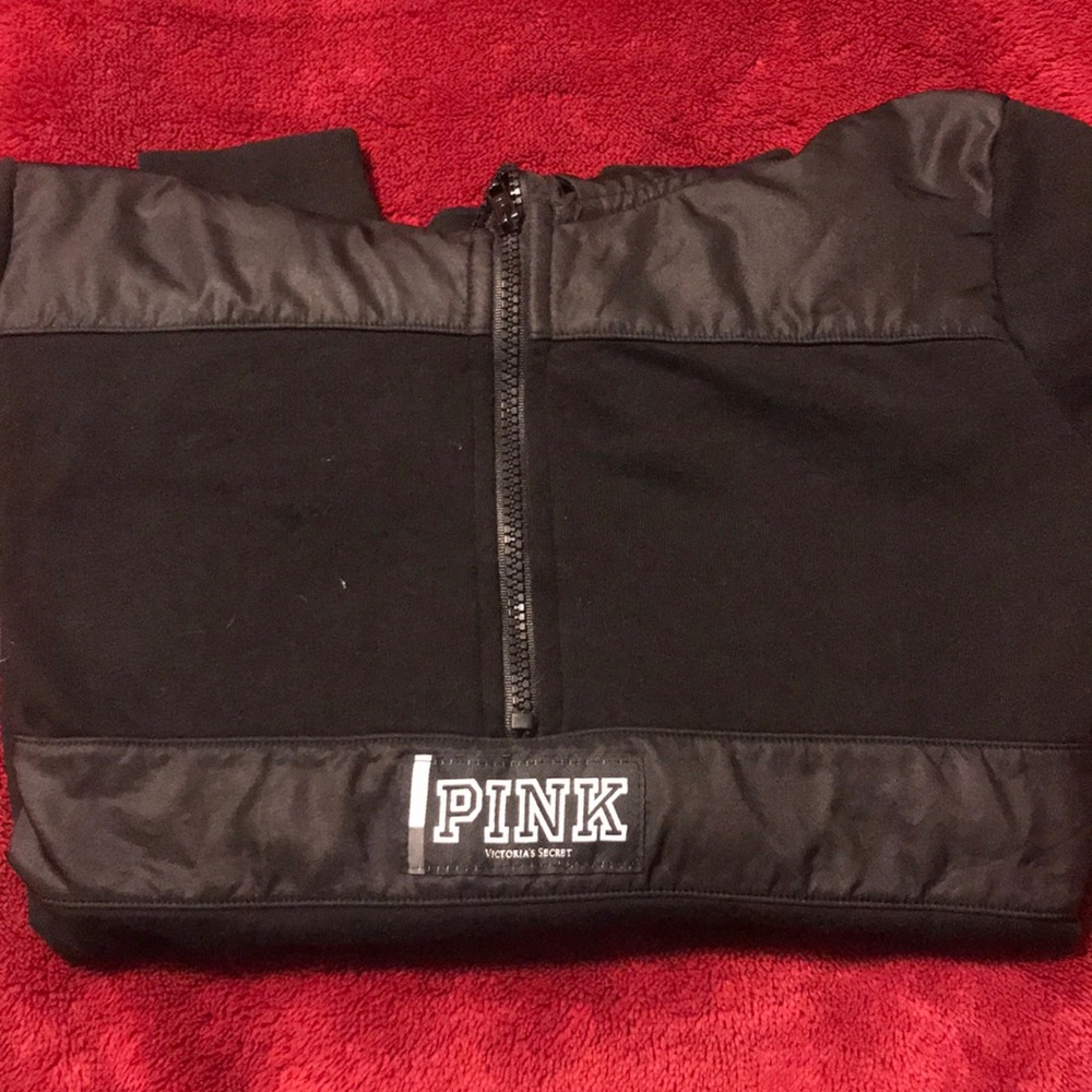 PINK quarter-zip hoodie.